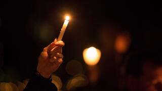 image of candlelight vigil for victims
