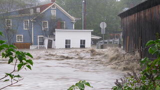 image of flooded home and barn