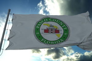 flag with official seal of pasco county florida in sunshine