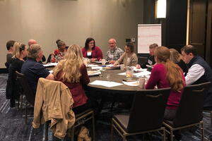 One of the session track groups hard at work discussing the many session ideas submitted by members