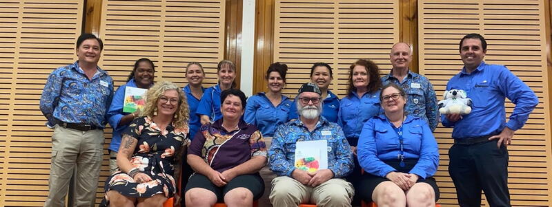 Staff in blue shirts